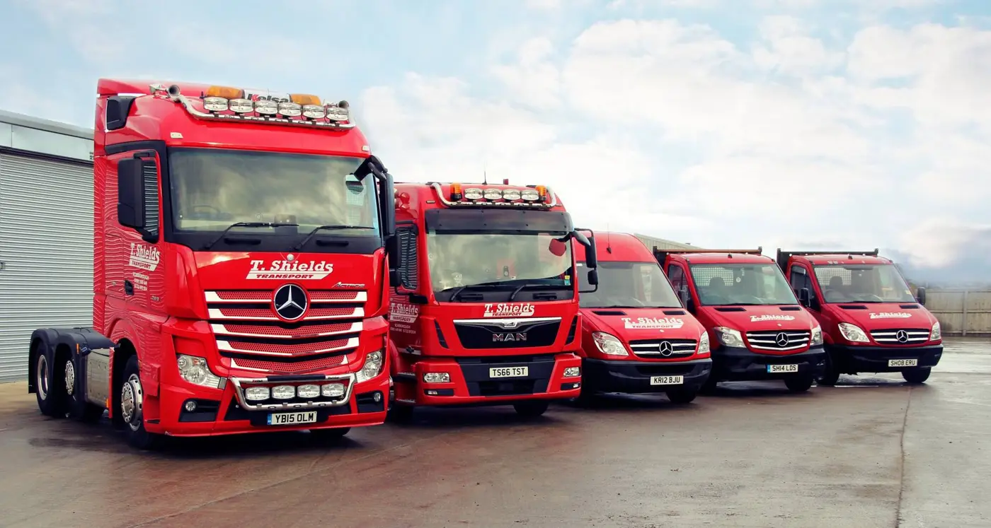 T Shields Transport vans and lorries lined up at the yard North Yorkshire