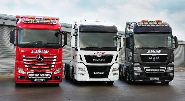 Red, white and black tractor units in the T Shields Transport fleet North Yorkshire